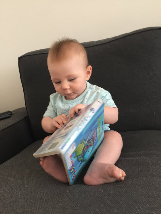 Baby reading a book